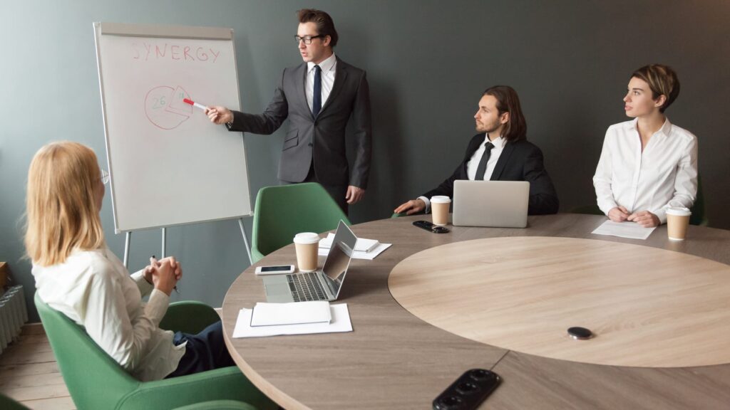 Business coach presenting to a team