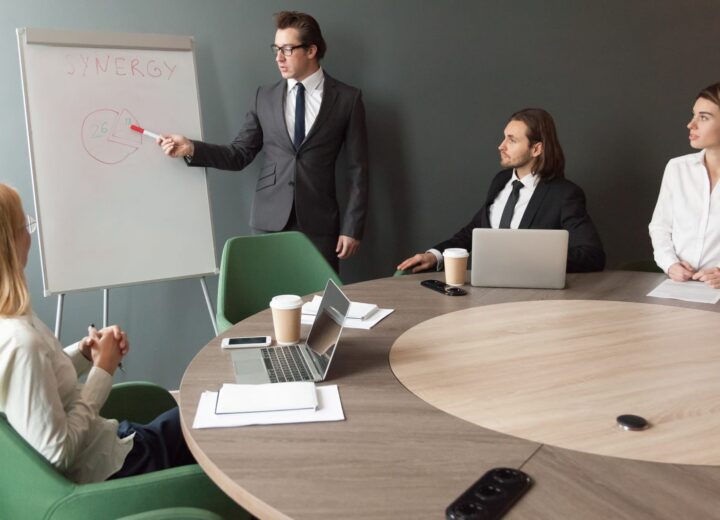 Business coach presenting to a team