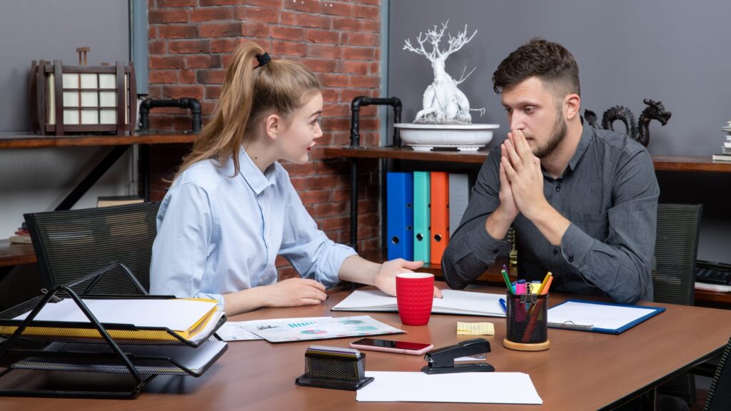 Colleagues in a supportive coaching conversation