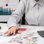 Professional reviewing her work and plans