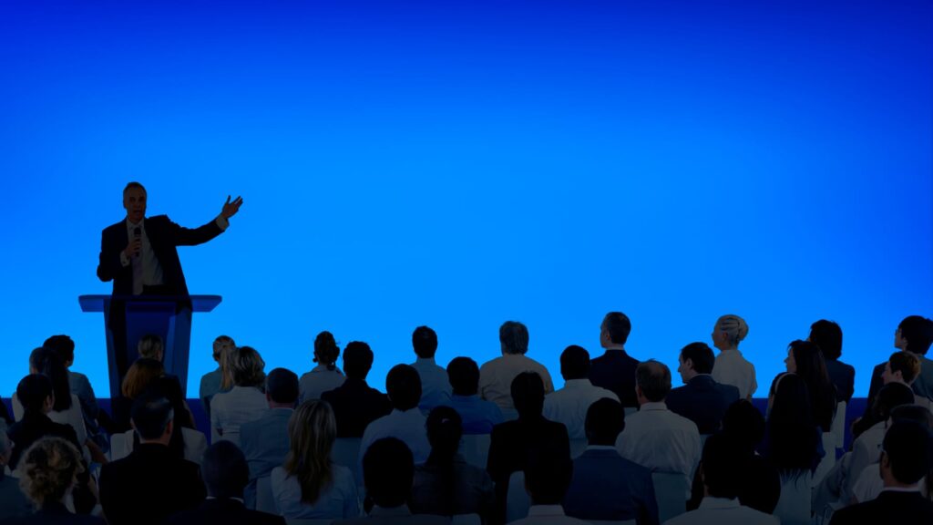 Business presenter addressing an audience