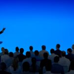 Business presenter addressing an audience