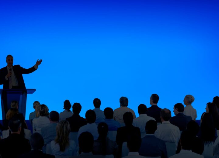 Business presenter addressing an audience